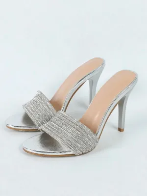 Stone studded silver pencil heels